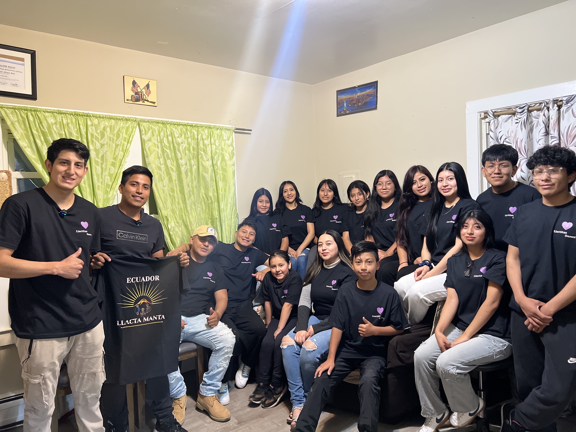 Dance group wearing coordinated black custom shirts