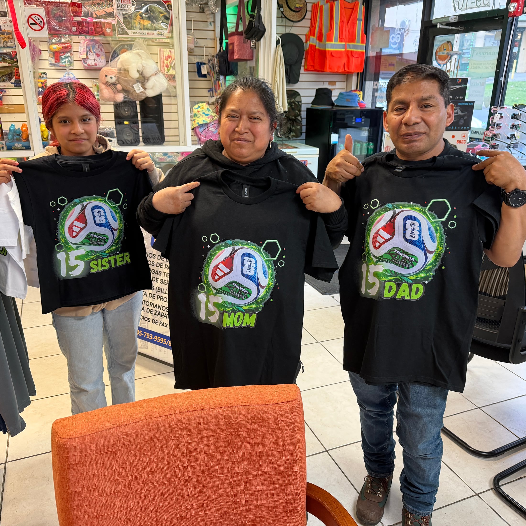 Family holding black personalized event shirts