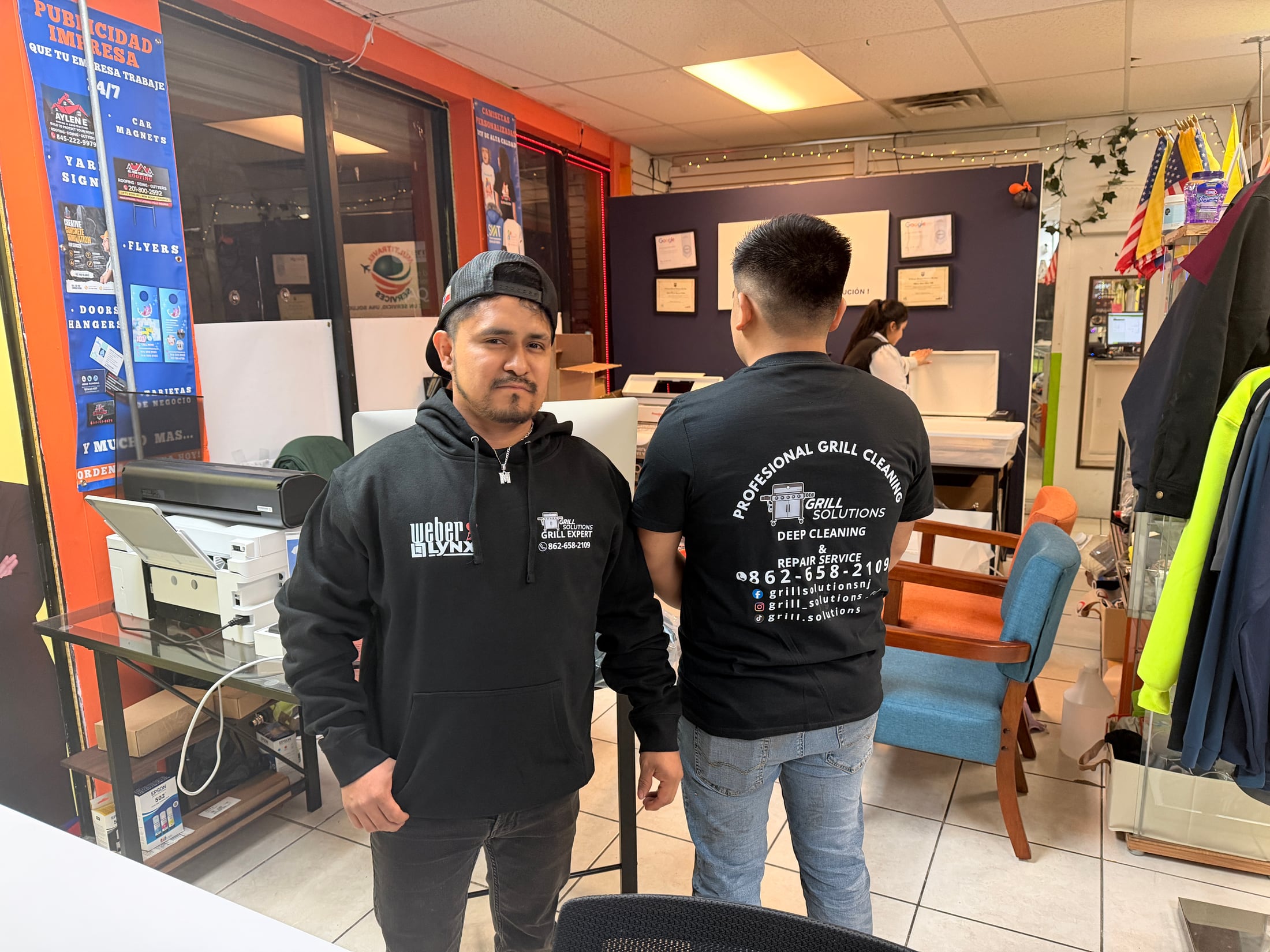 Local business team showing custom apparel produced by DG RISE